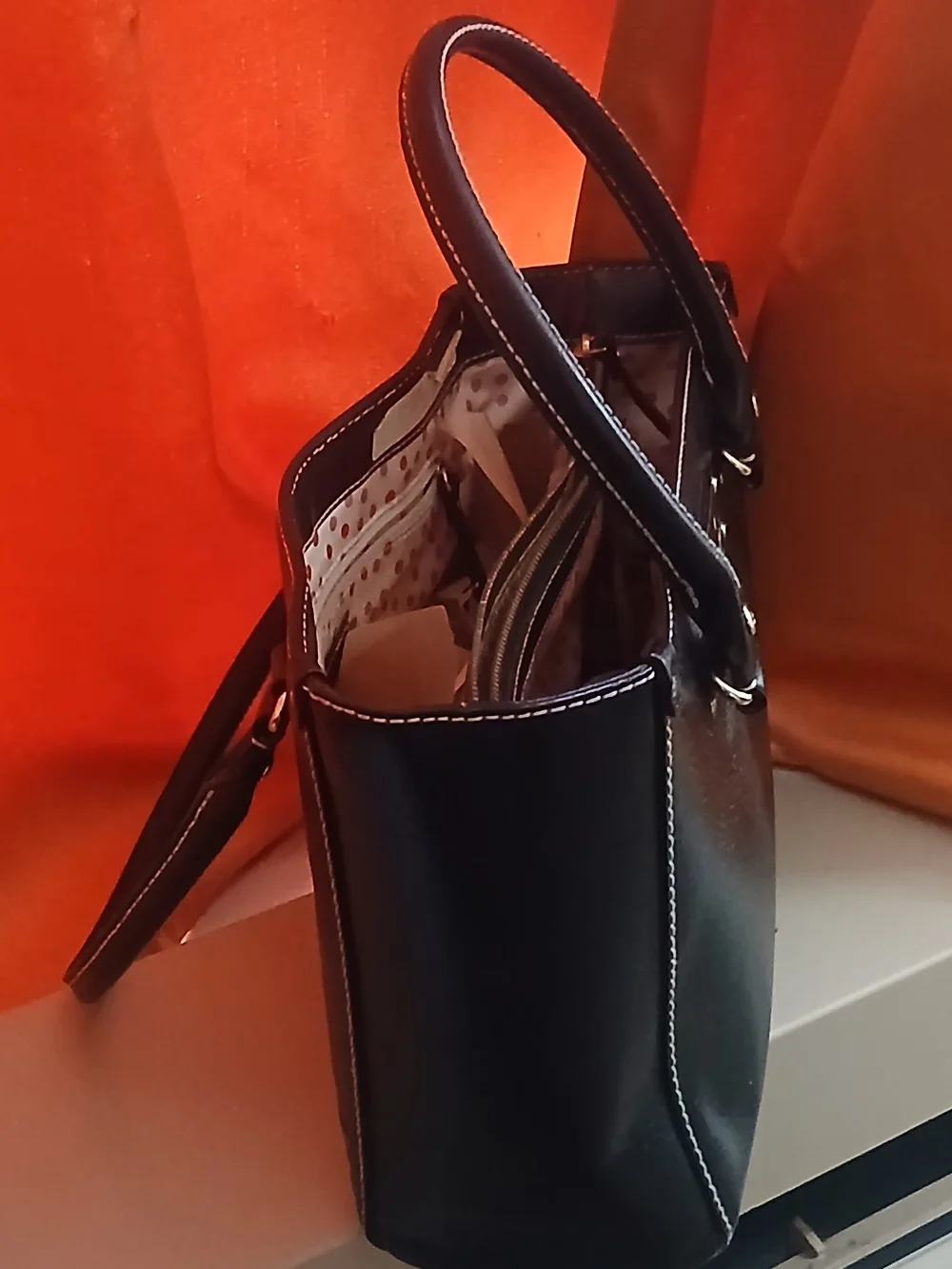 kate spade black leather satchel with polka-dot interior